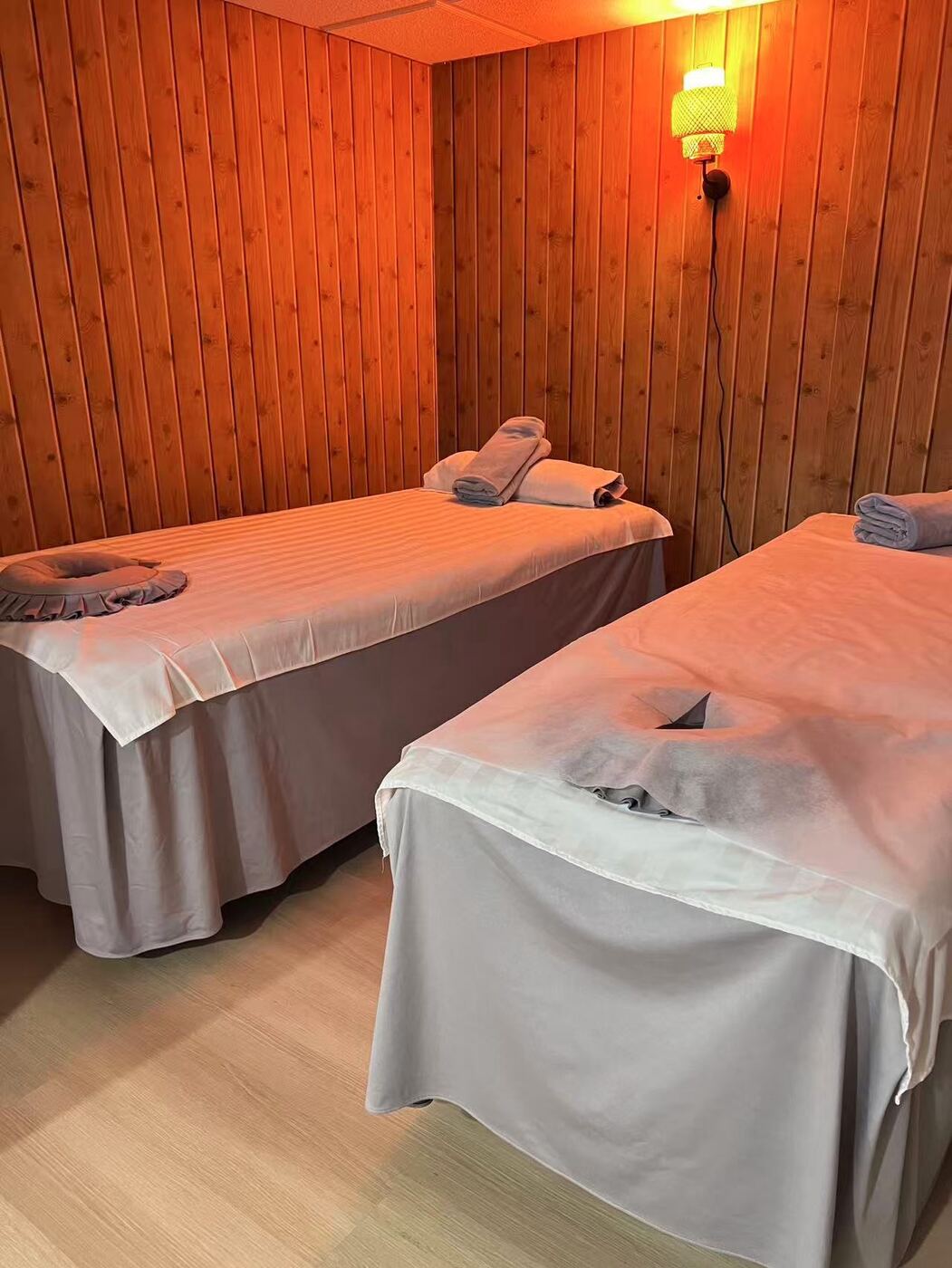 Couples spa room with two treatment beds at Eastern Head Spa in Mineola, Long Island