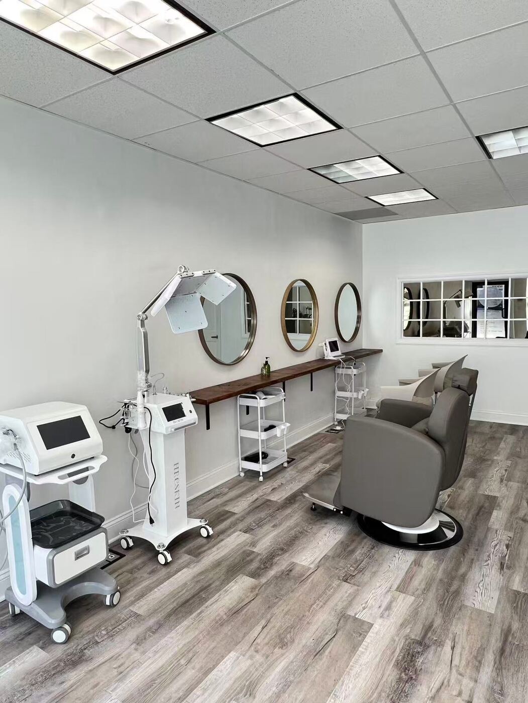Head spa equipment and treatment chair in a bright room at Eastern Head Spa Mineola